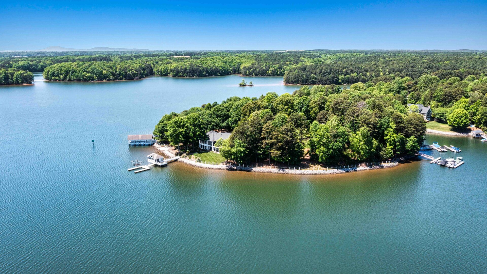 A small island in the middle of a lake.