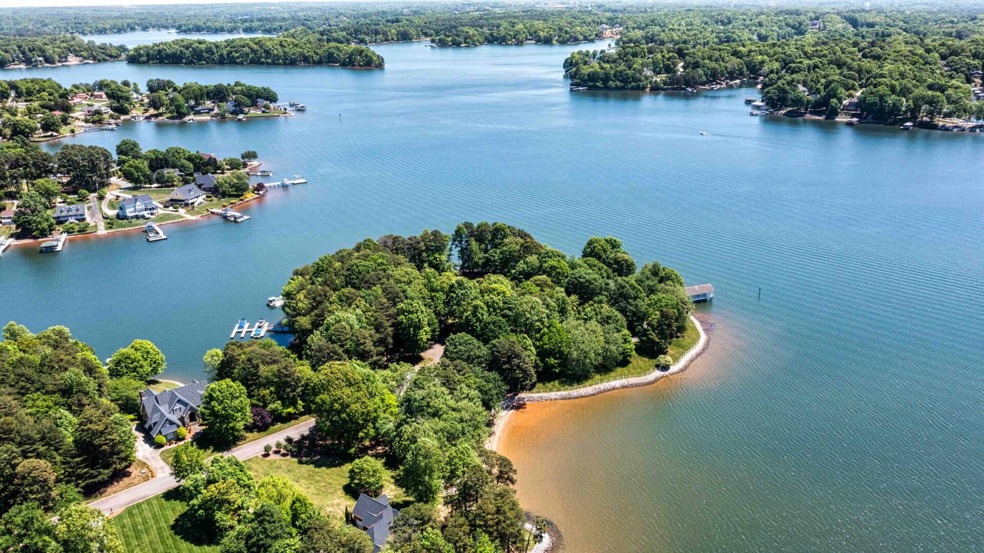 A small island in the middle of a lake.