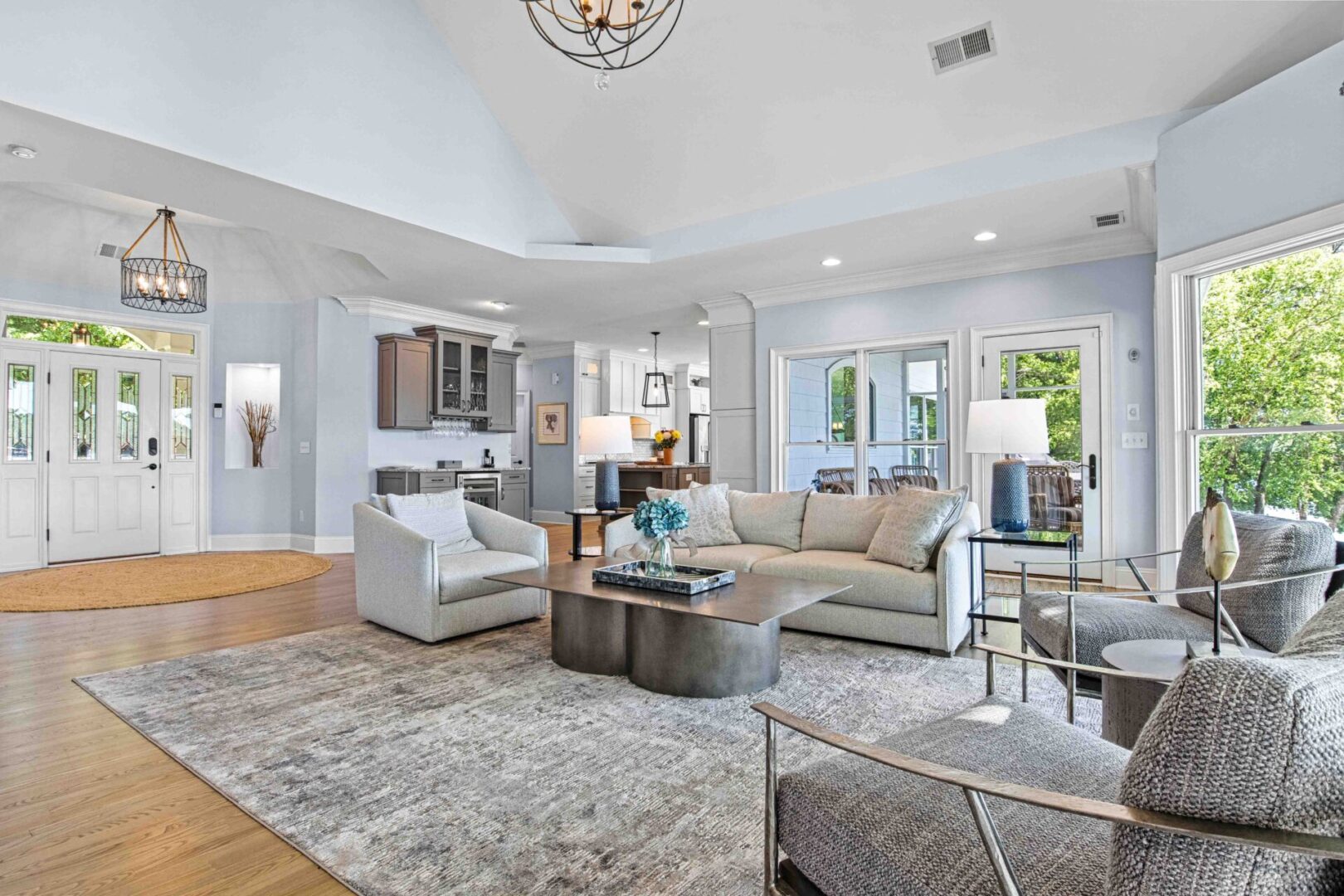 A living room with a couch, chair and table.