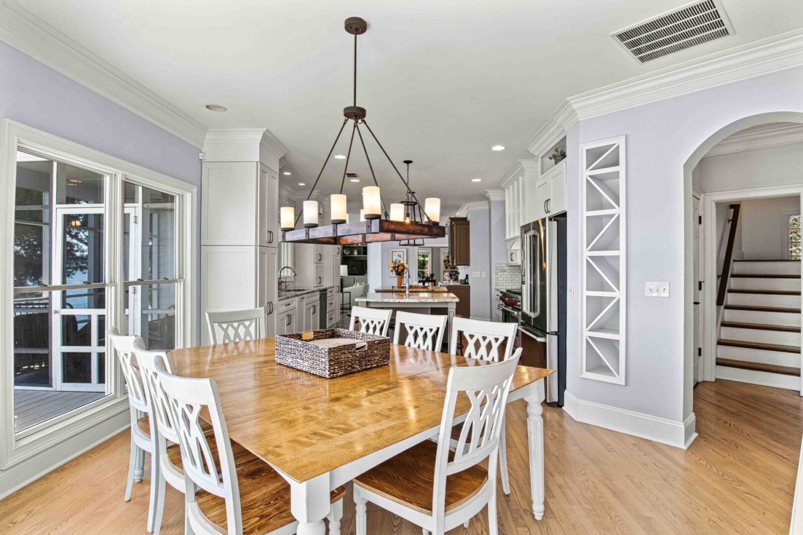 A dining room table with chairs around it