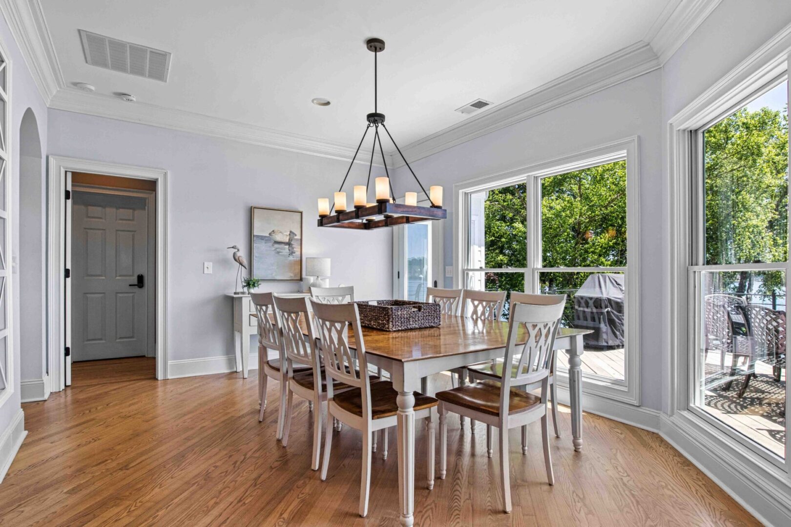 A dining room table with chairs around it