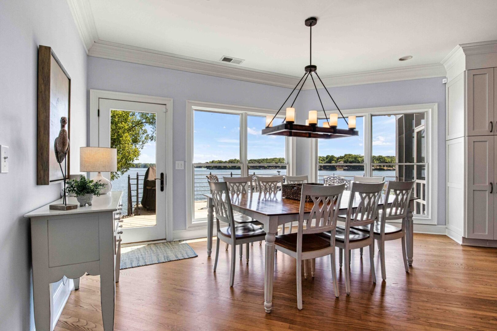 A dining room with a table and chairs in it