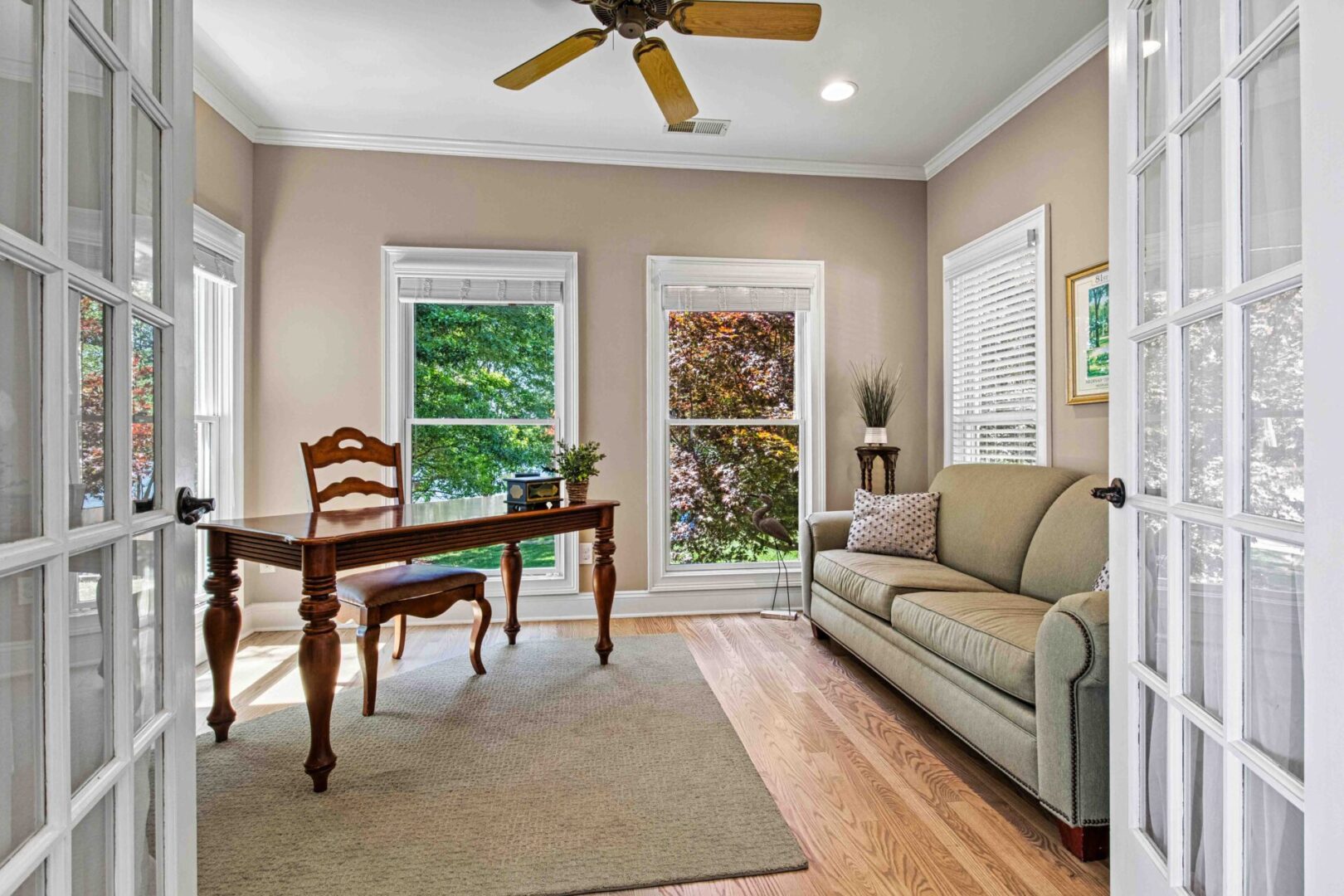 A living room with a couch, table and chair.