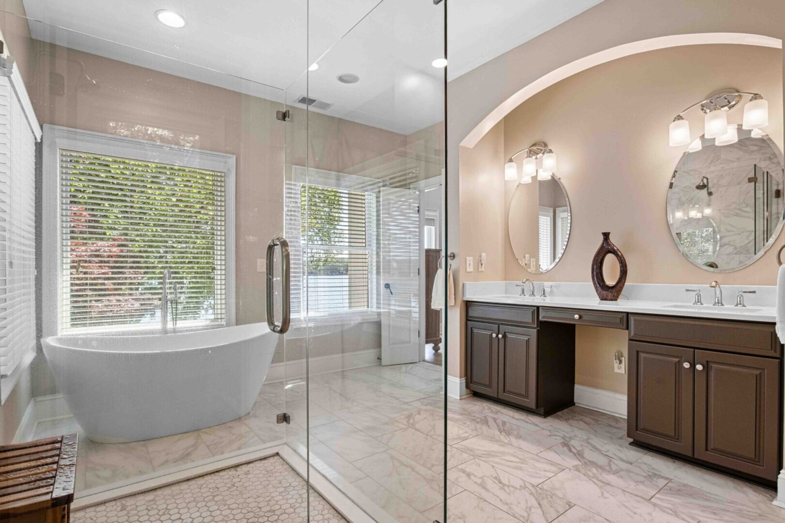 A bathroom with a tub, sink and shower.