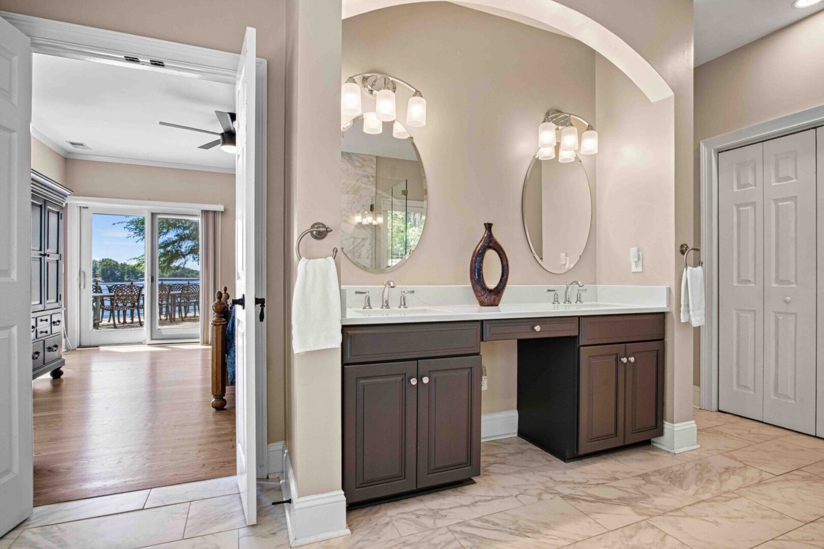 A bathroom with two sinks and mirrors in it