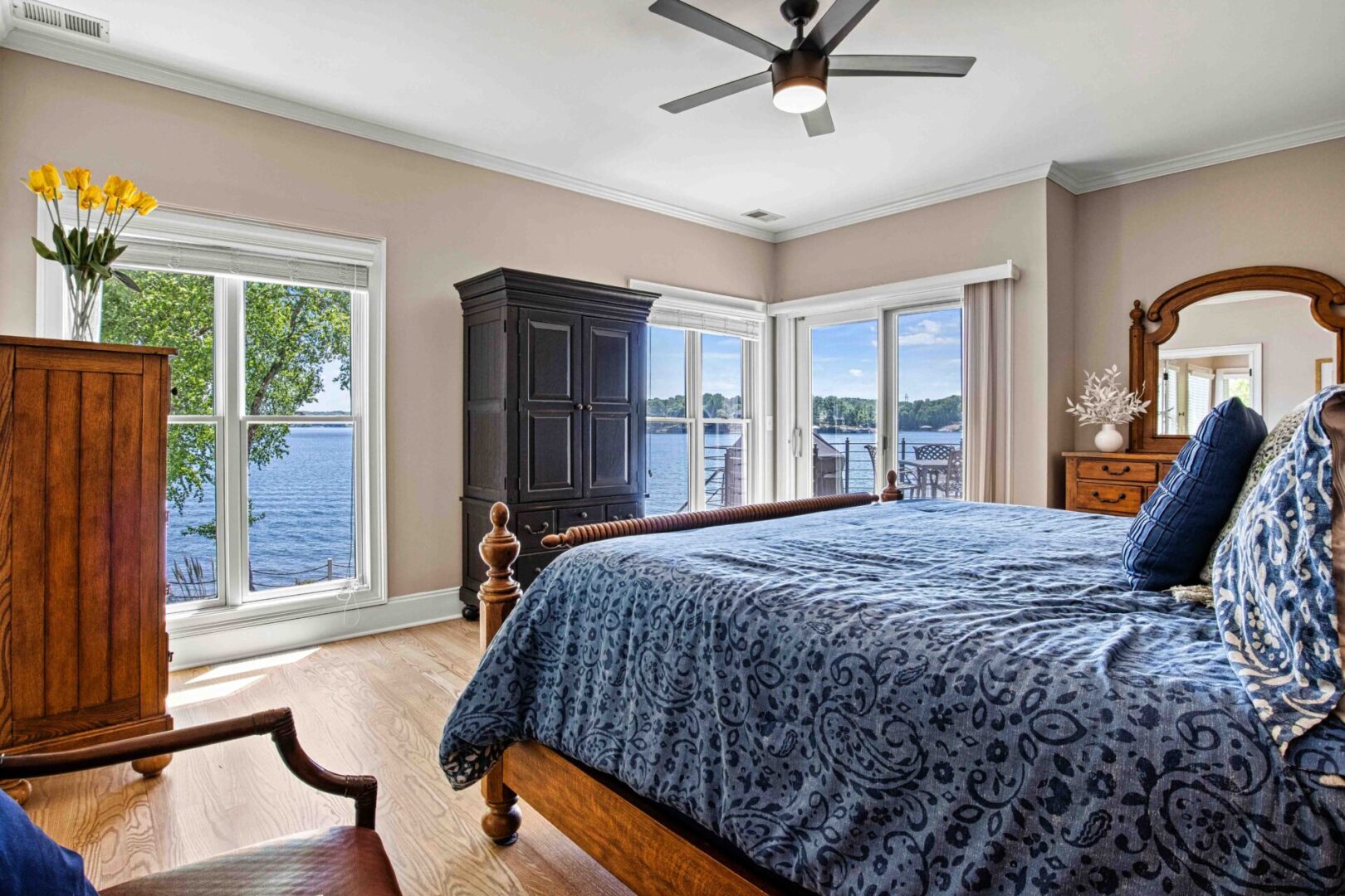 A bedroom with a large bed and a dresser.