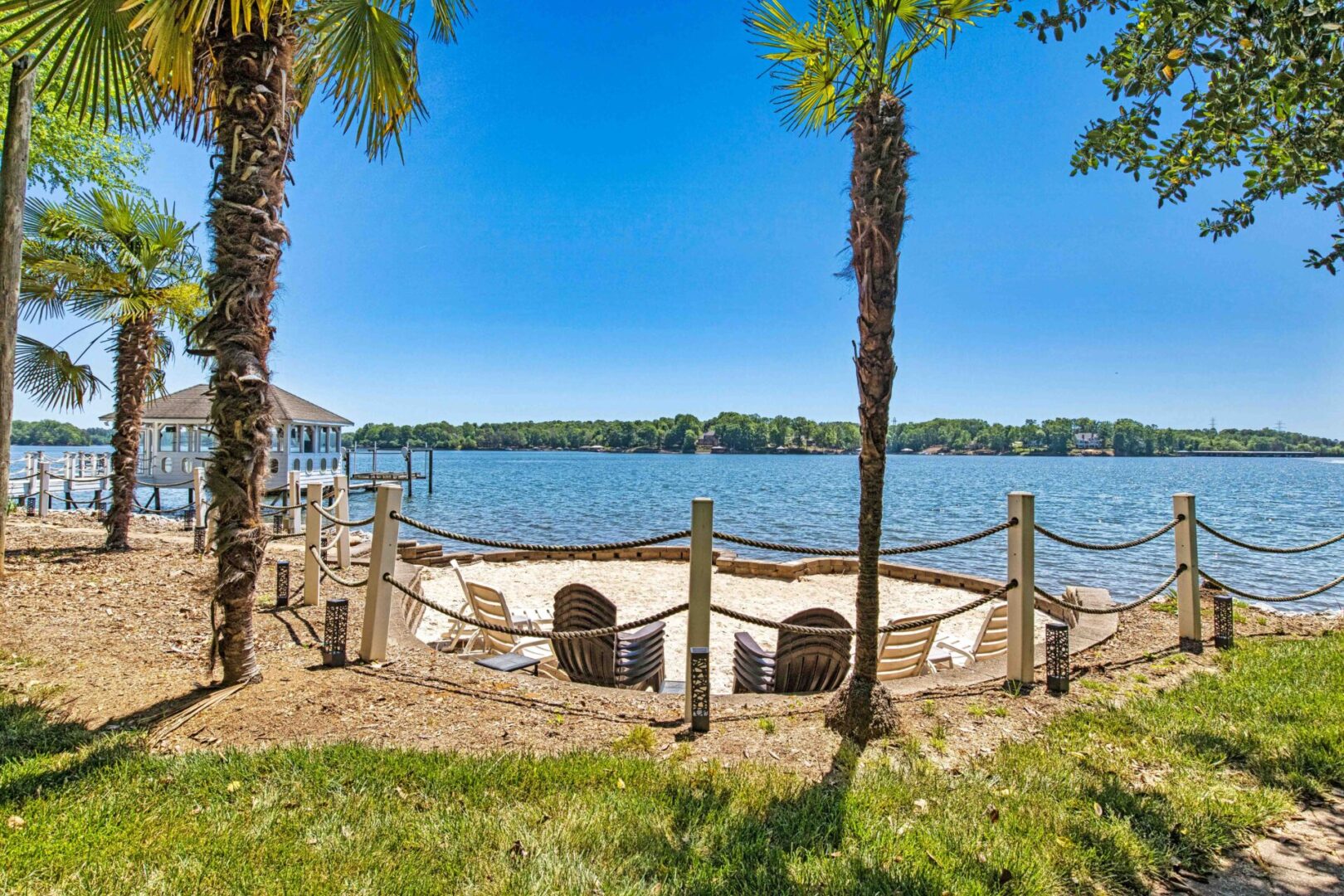 A boat is parked on the shore of a lake.