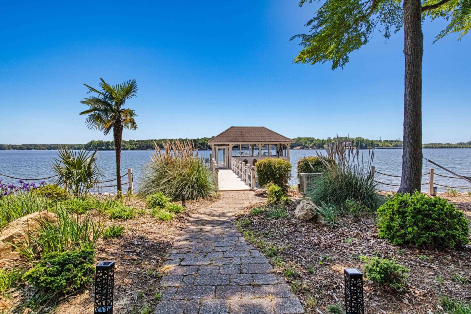 A dock with a pier and walkway leading to the water.